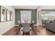 Elegant dining room with hardwood floors, stylish decor, and a view to the backyard at 5417 Flat Rock Pt, Stonecrest, GA 30038