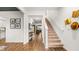 Grand entryway with elegant staircase and hardwood flooring, exuding a welcoming ambiance at 5417 Flat Rock Pt, Stonecrest, GA 30038