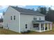 Spacious home with an inviting covered patio and large backyard, perfect for outdoor enjoyment at 5417 Flat Rock Pt, Stonecrest, GA 30038