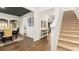 Inviting foyer features hardwood floors, stairs, and access to the kitchen and dining room at 5417 Flat Rock Pt, Stonecrest, GA 30038