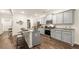 Modern kitchen with gray cabinets, granite countertops, stainless steel appliances, and a center island at 5417 Flat Rock Pt, Stonecrest, GA 30038