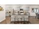 Modern kitchen with stainless steel appliances, granite countertops, and a center island at 5417 Flat Rock Pt, Stonecrest, GA 30038