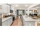 Beautiful kitchen with gray cabinets, granite countertops, stainless appliances, and an open floor plan at 5417 Flat Rock Pt, Stonecrest, GA 30038