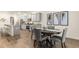Open concept with an island, dining area, and modern kitchen with stainless steel appliances at 5417 Flat Rock Pt, Stonecrest, GA 30038
