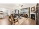 Open-concept living area with kitchen, dining, and fireplace, perfect for entertaining at 5417 Flat Rock Pt, Stonecrest, GA 30038