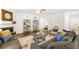 Spacious living room featuring contemporary decor, hardwood flooring, and lots of natural light at 5417 Flat Rock Pt, Stonecrest, GA 30038