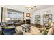 Comfortable living room with large windows, a cozy fireplace, and modern furnishings at 5417 Flat Rock Pt, Stonecrest, GA 30038
