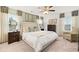 Large main bedroom with neutral tones, sitting area, carpet, and large windows at 5417 Flat Rock Pt, Stonecrest, GA 30038