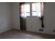 Bedroom with natural light, window, and patterned curtains at 661 White Bird Way, Fairburn, GA 30213