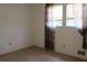 Bedroom with natural light, window, and patterned curtains at 661 White Bird Way, Fairburn, GA 30213