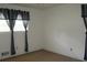 Bedroom featuring window with modern black and white curtains at 661 White Bird Way, Fairburn, GA 30213
