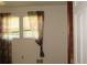 Bright bedroom with window and patterned curtains at 661 White Bird Way, Fairburn, GA 30213
