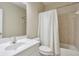 Bathroom with a single sink vanity and a tiled shower with curtain at 251 Vinings Retreat Sw Vw, Mableton, GA 30126