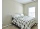 Bedroom with a bed with gray and white checkered pattern and natural light at 251 Vinings Retreat Sw Vw, Mableton, GA 30126