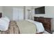 Bedroom with a bed and dresser with tv above it at 251 Vinings Retreat Sw Vw, Mableton, GA 30126
