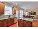 Open kitchen flows into dining area with stainless appliances and wood cabinetry at 251 Vinings Retreat Sw Vw, Mableton, GA 30126