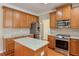 Stylish kitchen showcases granite countertops, stainless steel appliances, and hardwood floors at 251 Vinings Retreat Sw Vw, Mableton, GA 30126