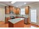 Well-equipped kitchen featuring granite countertops, stainless steel appliances, and central island at 251 Vinings Retreat Sw Vw, Mableton, GA 30126