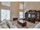 Inviting living room with a fireplace, large windows, and comfortable seating area at 251 Vinings Retreat Sw Vw, Mableton, GA 30126