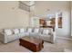 Bright living room featuring a large sectional sofa, with a view to the kitchen at 251 Vinings Retreat Sw Vw, Mableton, GA 30126
