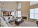 Cozy living room with fireplace, high ceilings, and abundant natural light and comfortable seating at 251 Vinings Retreat Sw Vw, Mableton, GA 30126