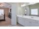 Main bathroom view of double sinks, tub and doorway to main bedroom at 251 Vinings Retreat Sw Vw, Mableton, GA 30126