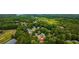 Aerial view of a wooded neighborhood with a lake in the distance at 308 Lismore Ter, Woodstock, GA 30189