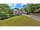 Beautiful two-story brick home with well-manicured front lawn at 308 Lismore Ter, Woodstock, GA 30189