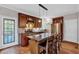 Modern kitchen with hardwood floors, stainless steel appliances, and an island with seating at 308 Lismore Ter, Woodstock, GA 30189