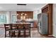 A spacious kitchen with an island with seating, stainless steel appliances, and custom cabinetry at 308 Lismore Ter, Woodstock, GA 30189
