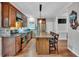 Modern kitchen with hardwood floors, stainless steel appliances, and an island with seating at 308 Lismore Ter, Woodstock, GA 30189