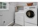 Laundry room with side by side washer and dryer at 308 Lismore Ter, Woodstock, GA 30189