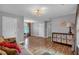 Living room area featuring wood floors, modern lighting and access to other parts of the home at 308 Lismore Ter, Woodstock, GA 30189