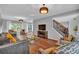 Spacious living room with hardwood floors, recessed lighting, modern furnishings, and an inviting atmosphere at 308 Lismore Ter, Woodstock, GA 30189