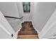 Carpeted stairwell with access to the lower level of the home at 308 Lismore Ter, Woodstock, GA 30189