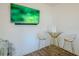 Modern bar area with a tall table, two metal chairs, and mounted TV at 351 Clay St, Grayson, GA 30017