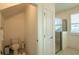 Bright bathroom features a toilet, linen closet, and enclosed shower at 351 Clay St, Grayson, GA 30017
