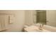 Bathroom featuring a vanity, sink, mirror, towels and a tiled shower at 351 Clay St, Grayson, GA 30017