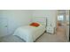 Bedroom with a comfortable bed, neutral carpet, and an adjacent doorway at 351 Clay St, Grayson, GA 30017