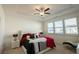 Bedroom with a decorative ceiling, comfortable bed, and ample natural light through the windows at 351 Clay St, Grayson, GA 30017