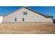 Exterior home view shows tan siding, brick foundation and well manicured lawn at 351 Clay St, Grayson, GA 30017