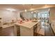 Bright, open kitchen with a large center island and stainless steel appliances at 351 Clay St, Grayson, GA 30017