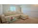 Comfortable living room with a plush sofa and a glass-top coffee table at 351 Clay St, Grayson, GA 30017