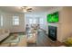 Cozy living room with a fireplace, ample seating, and stylish decor at 351 Clay St, Grayson, GA 30017
