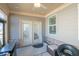 Relaxing covered patio area with ample seating and natural light at 351 Clay St, Grayson, GA 30017