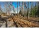 Nestled among the trees, this house offers a secluded retreat with a driveway and outdoor space at 4957 Hadaway Nw Rd, Kennesaw, GA 30152