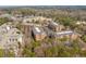 Panoramic aerial view showcasing the meticulously landscaped apartment complex surrounded by mature trees at 2300 Peachford Rd # 4004, Atlanta, GA 30338