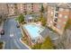 An aerial view showcasing the pool, clubhouse, and well-maintained buildings of the apartment complex at 2300 Peachford Rd # 4004, Atlanta, GA 30338
