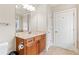 Bathroom featuring a light countertop vanity, mirror, and standard toilet at 2300 Peachford Rd # 4004, Atlanta, GA 30338