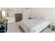 Well-lit bedroom with carpet, full bed, and dark wood furniture at 2300 Peachford Rd # 4004, Atlanta, GA 30338